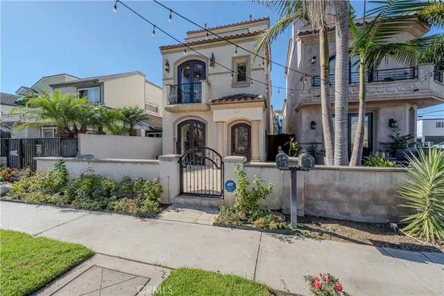a front view of a building with plants