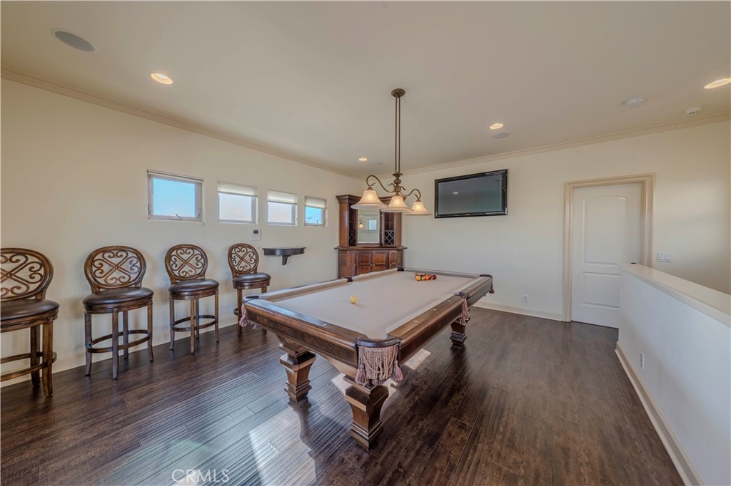 525 15th Street Huntington Beach, CA 92648 - Photo 41 of 46 a room with furniture and wooden floor