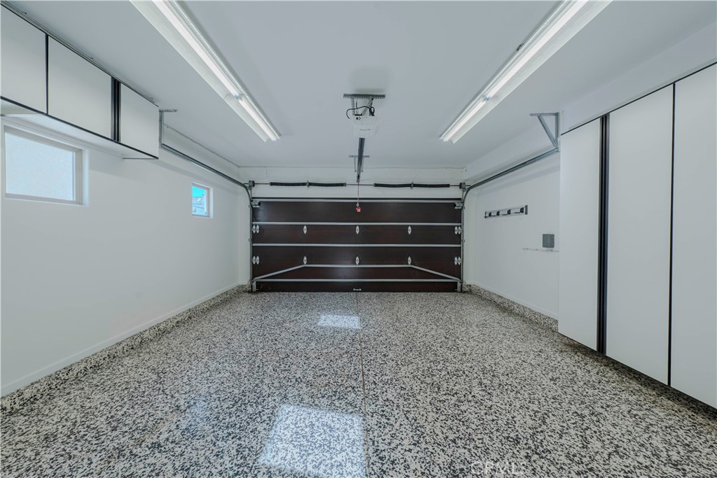 525 15th Street Huntington Beach, CA 92648 - Photo 44 of 46 a view of room with stairs and a chandelier