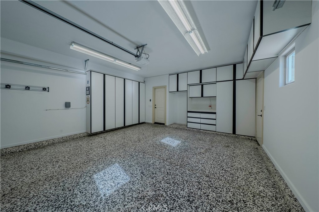 525 15th Street Huntington Beach, CA 92648 - Photo 45 of 46 a view of room with stairs and a refrigerator