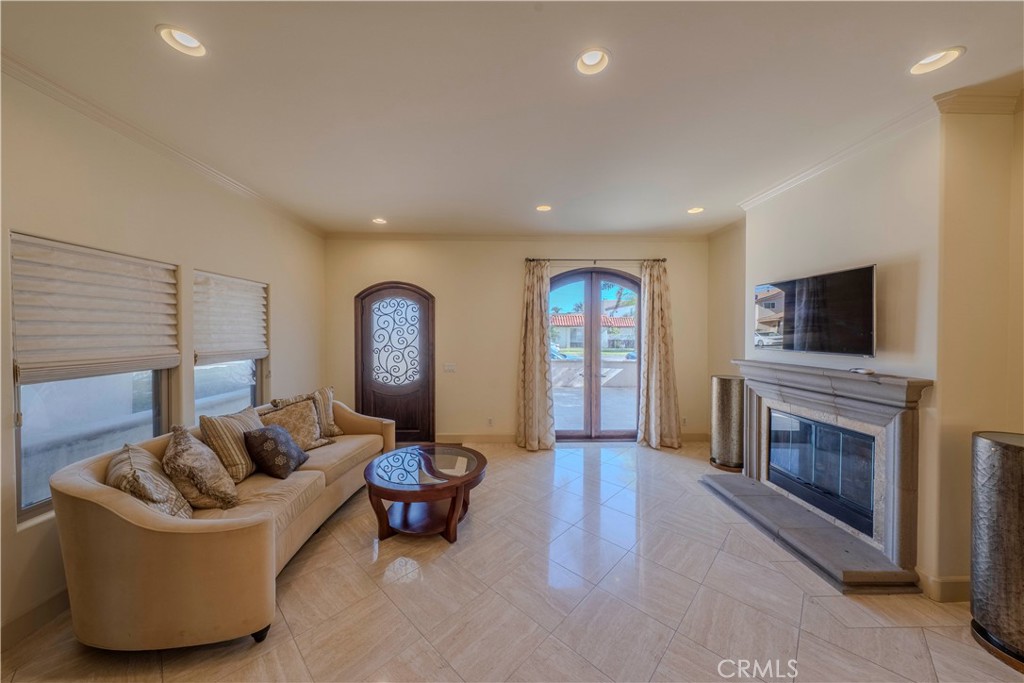 525 15th Street Huntington Beach, CA 92648 - Photo 9 of 46 a living room with furniture and a fireplace