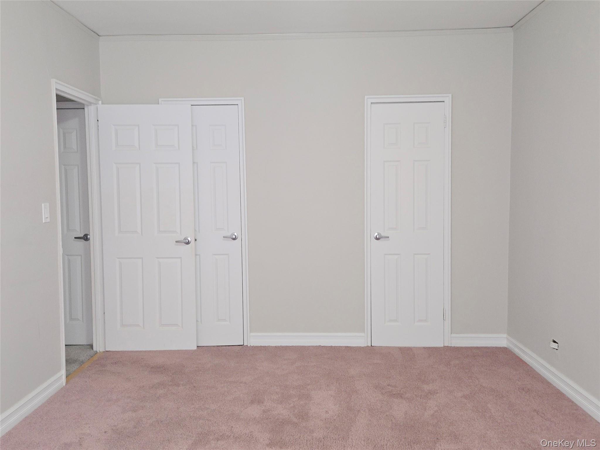 55 East 190th Street, Unit 45 Bronx, NY 10468 - Photo 13 of 13 Unfurnished bedroom featuring carpet floors and a closet