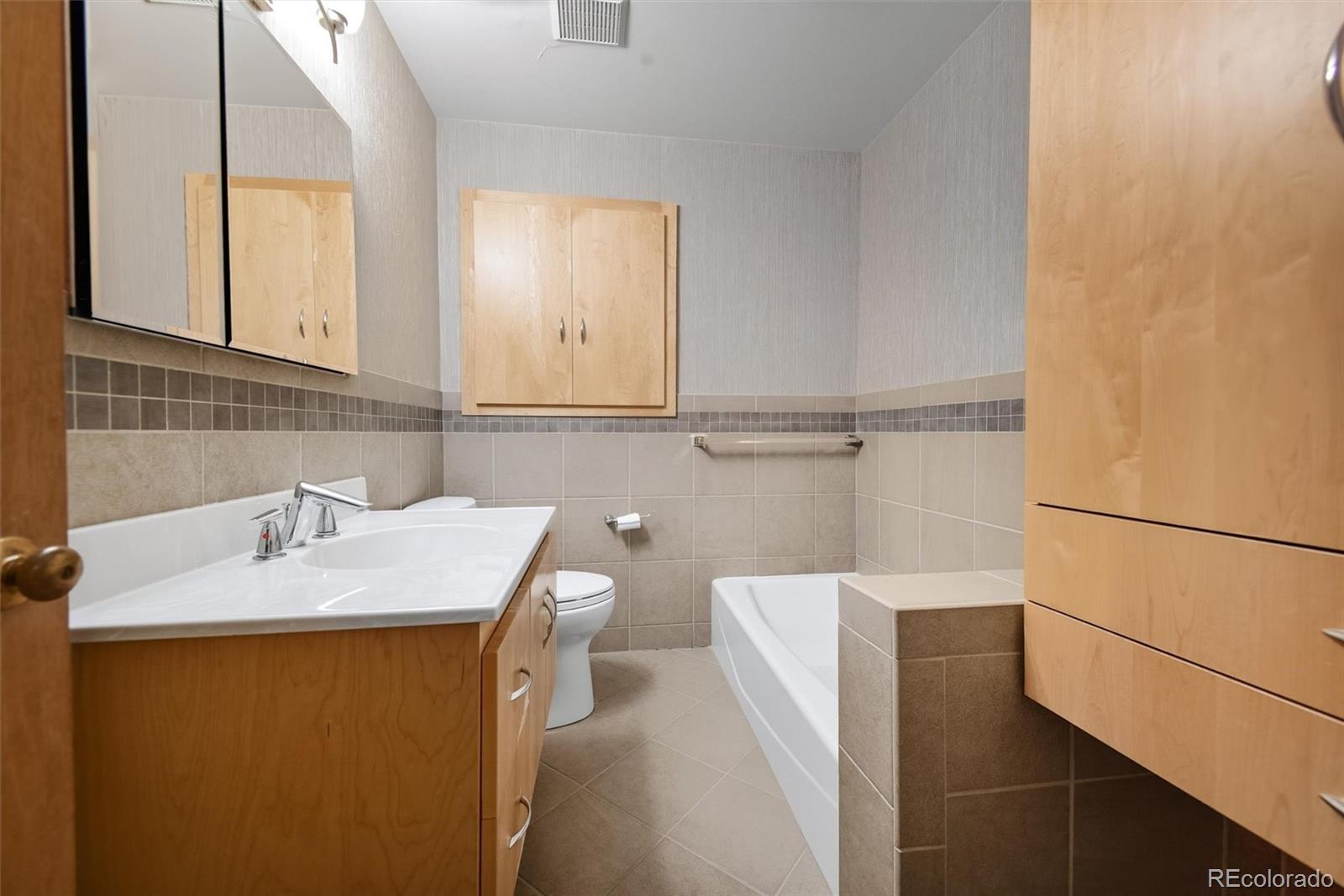 101 Hudson Street Denver, CO 80220 - Photo 12 of 27 a bathroom with a sink and a mirror