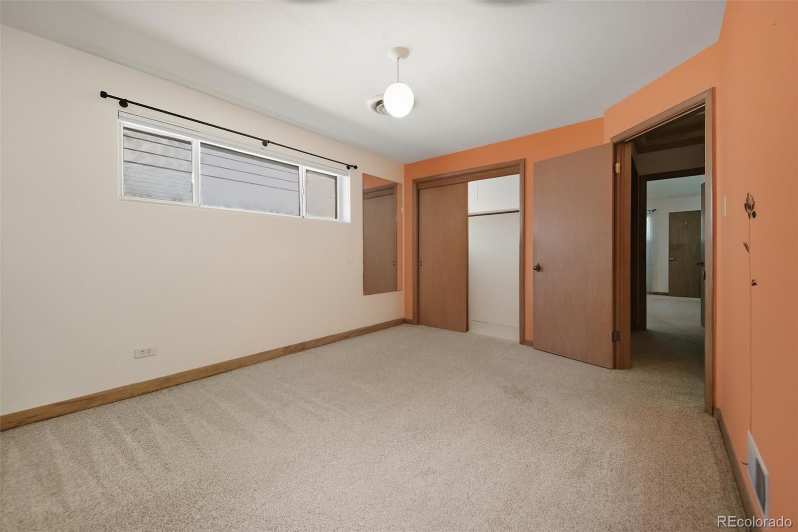 101 Hudson Street Denver, CO 80220 - Photo 13 of 27 a view of an empty room with a window