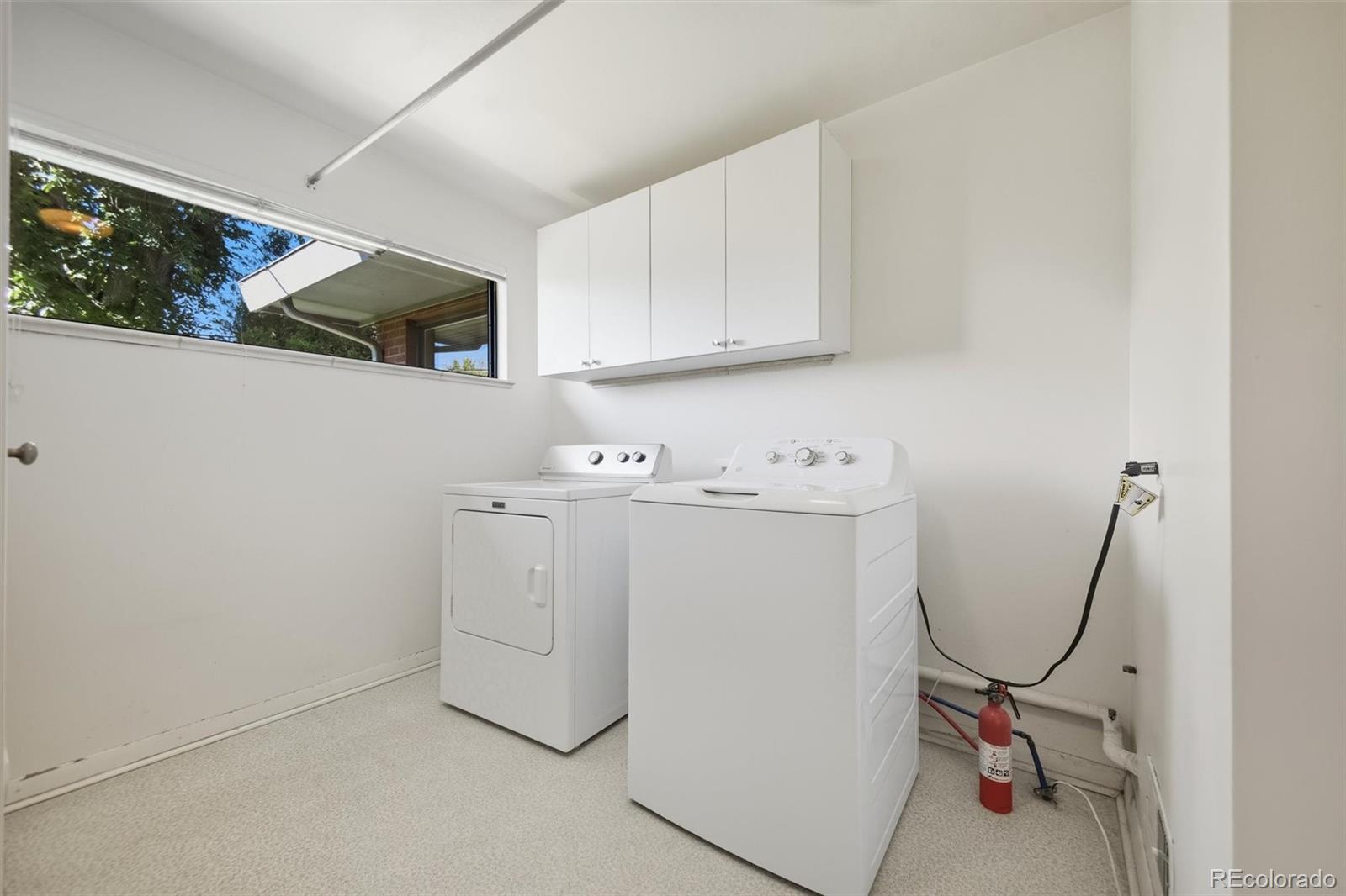 101 Hudson Street Denver, CO 80220 - Photo 19 of 27 a utility room with dryer and washer
