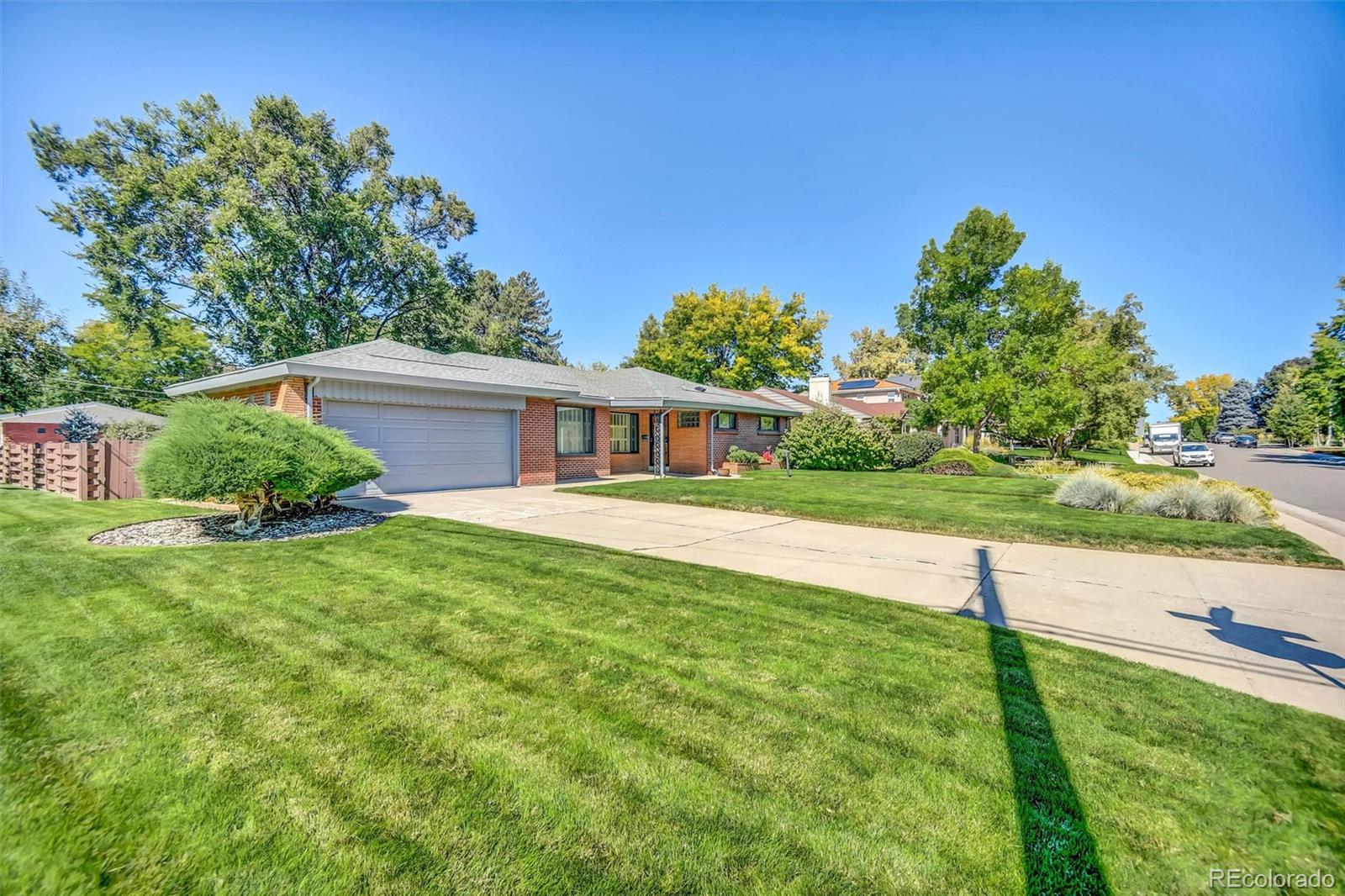 101 Hudson Street Denver, CO 80220 - Photo 20 of 27 a house with garden in front of it
