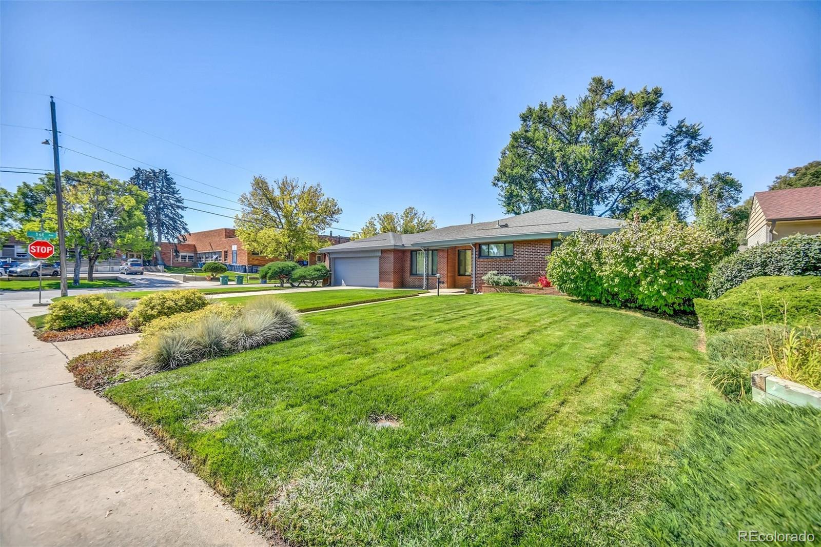 101 Hudson Street Denver, CO 80220 - Photo 2 of 27 a view of house with outdoor space and swimming pool