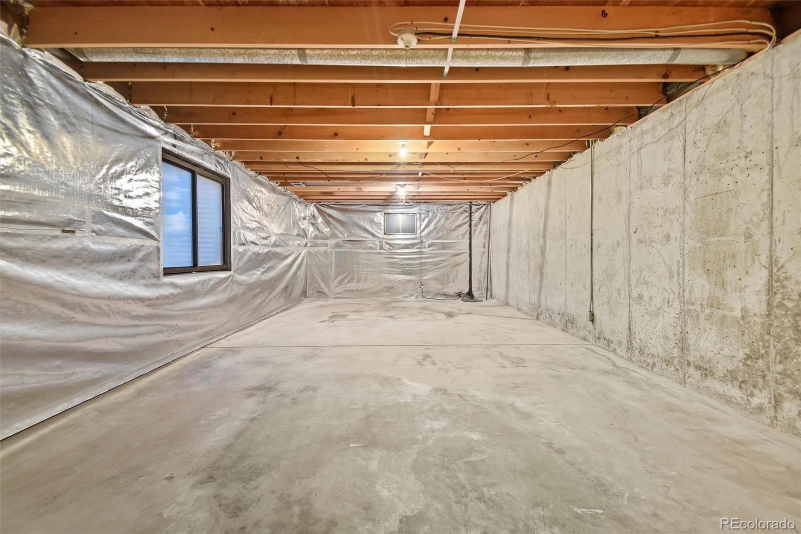 101 Hudson Street Denver, CO 80220 - Photo 21 of 27 a view of empty room with wooden walls