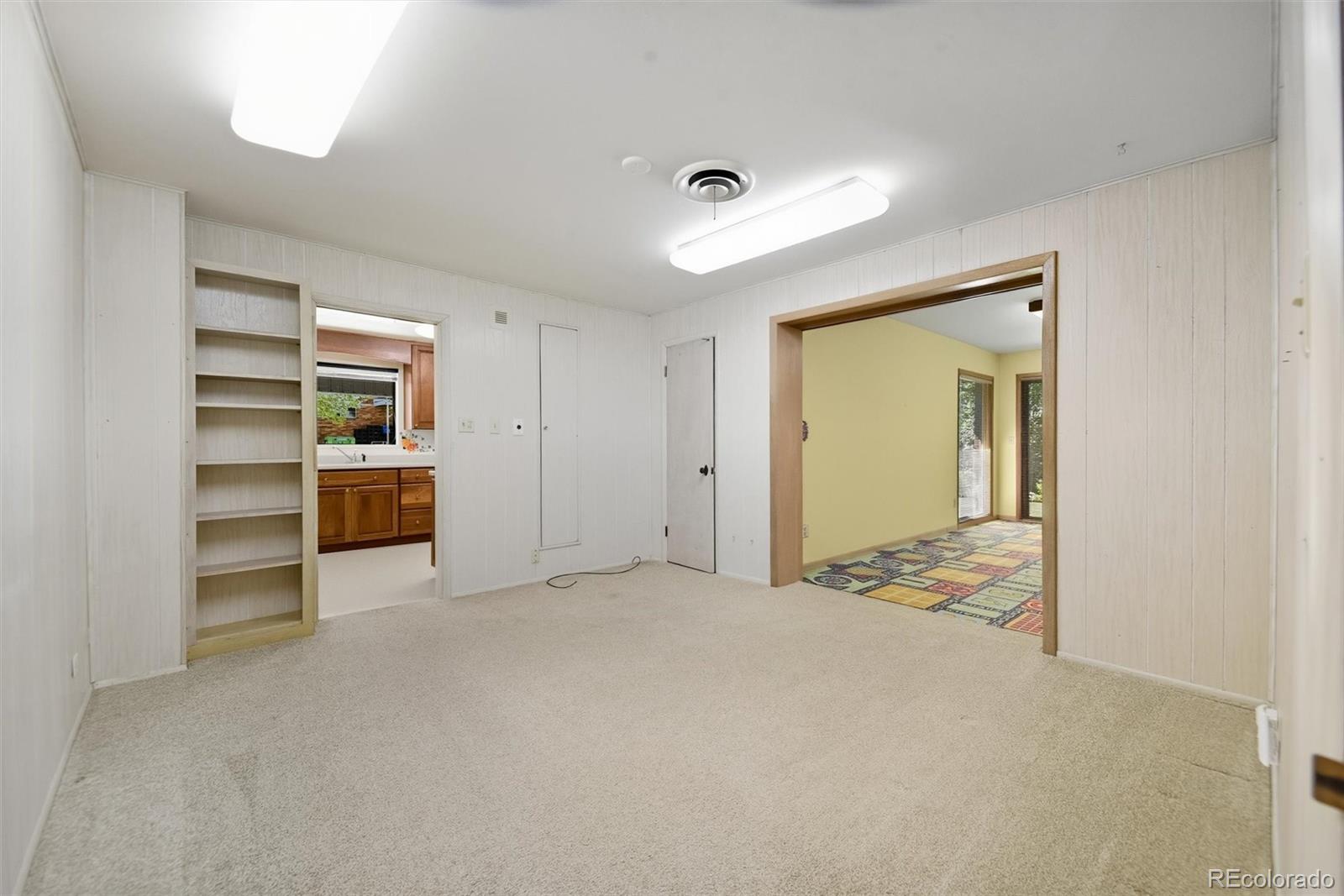 101 Hudson Street Denver, CO 80220 - Photo 6 of 27 a view of a room with cabinet and a window