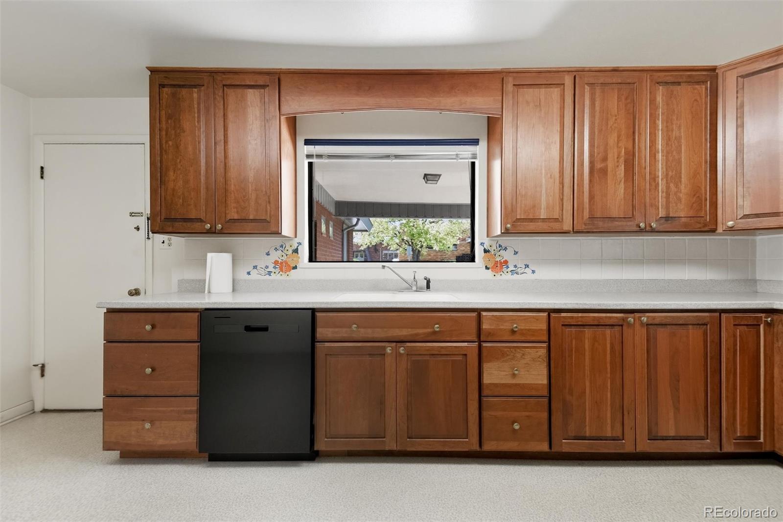 101 Hudson Street Denver, CO 80220 - Photo 8 of 27 a bathroom with a sink vanity and mirror