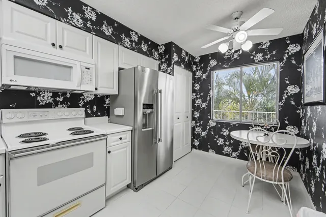 a dining room with furniture and a chandelier
