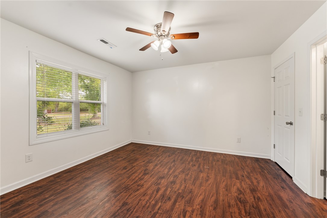 104 Leah Drive Pendleton, SC 29670 - Photo 13 of 23 This airy room features durable wood flooring and ample natural light.
