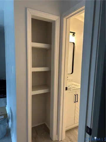 a view of walk in closet with empty racks