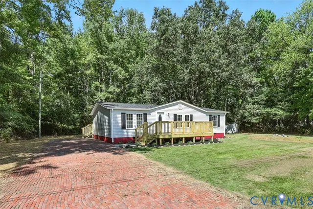 a view of house with outdoor space and swimming pool