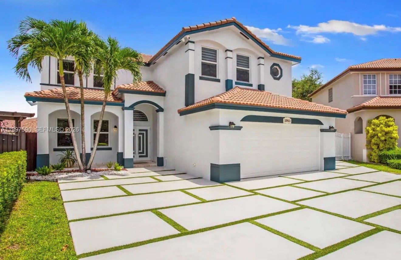 15411 Southwest 36th Terrace Miami, FL 33185 - Photo 1 of 45 a front view of a house with a yard