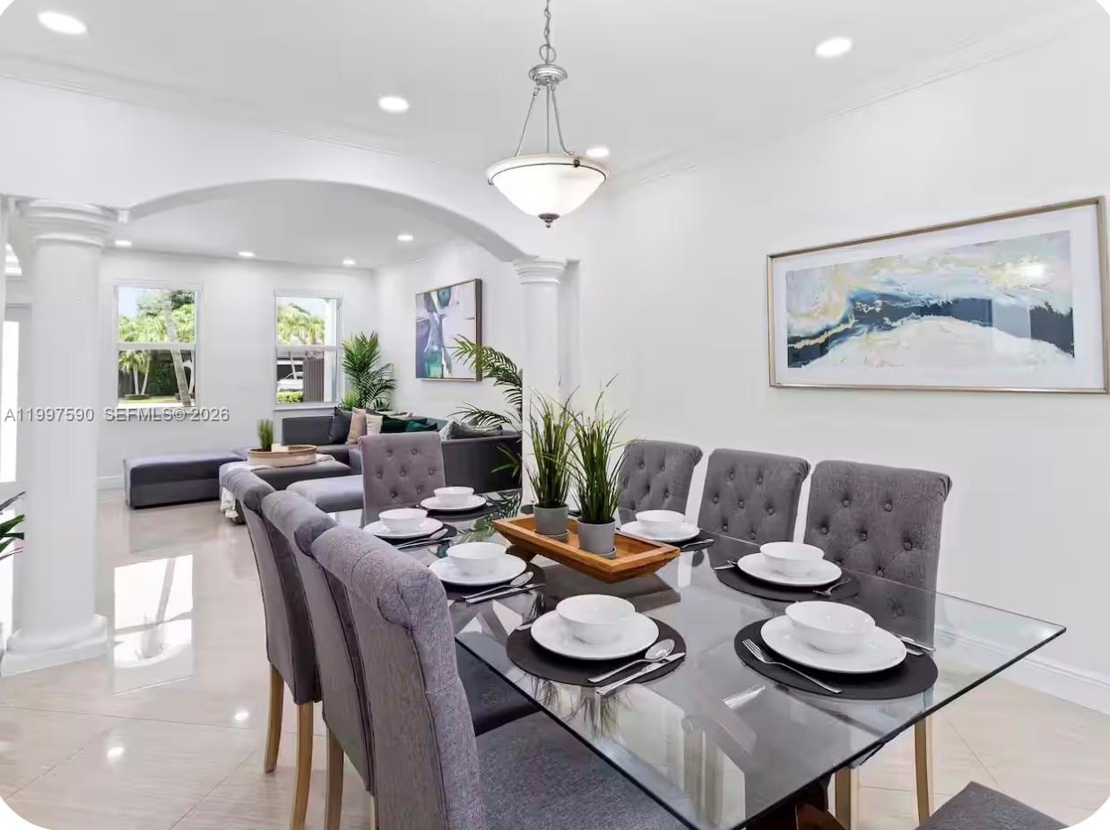 15411 Southwest 36th Terrace Miami, FL 33185 - Photo 13 of 45 a view of a dining room with furniture and wooden floor
