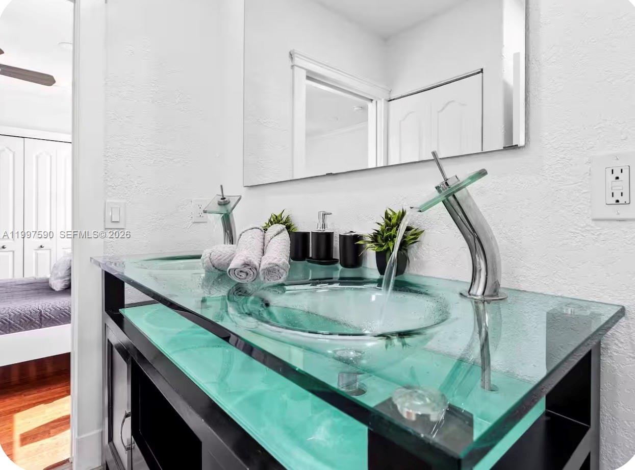 15411 Southwest 36th Terrace Miami, FL 33185 - Photo 28 of 45 a bathroom with a sink and a mirror