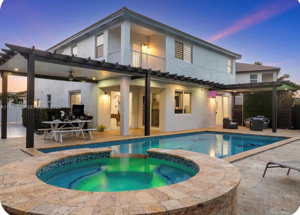 15411 Southwest 36th Terrace Miami, FL 33185 - Photo 35 of 45 a view of a house with swimming pool and sitting area