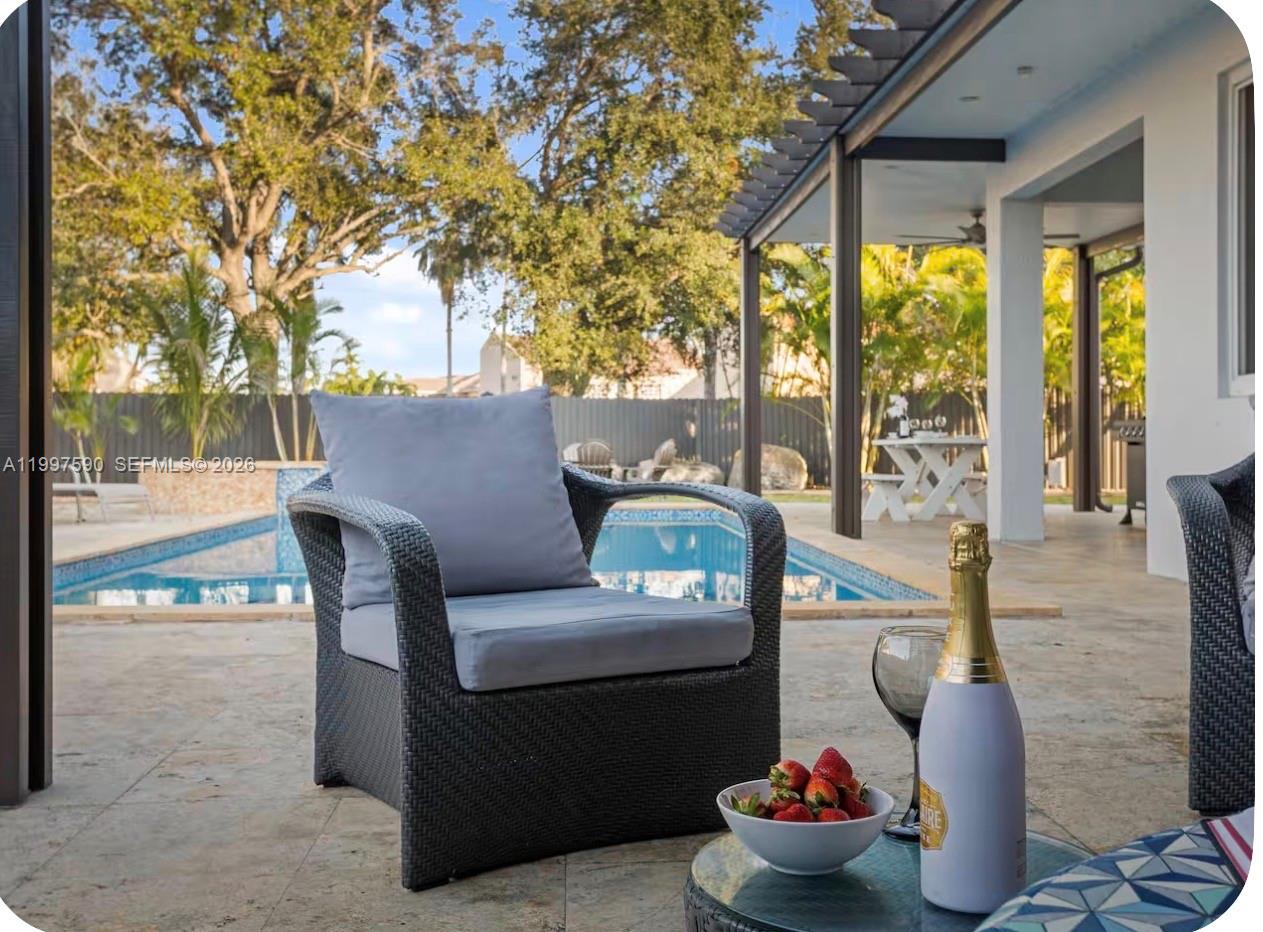 15411 Southwest 36th Terrace Miami, FL 33185 - Photo 39 of 45 a outdoor living space with furniture and a potted plant