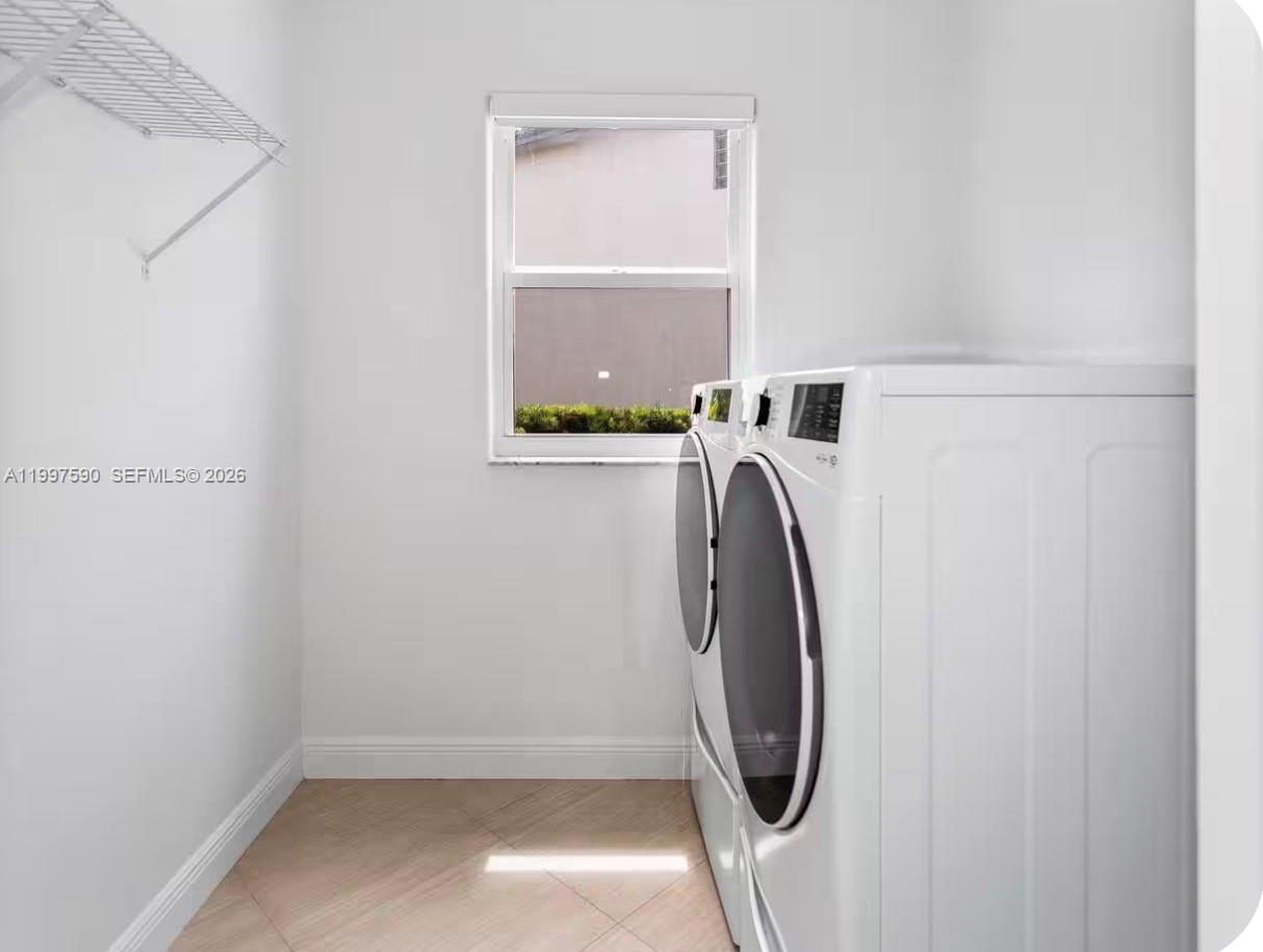 15411 Southwest 36th Terrace Miami, FL 33185 - Photo 40 of 45 a utility room with dryer and washer