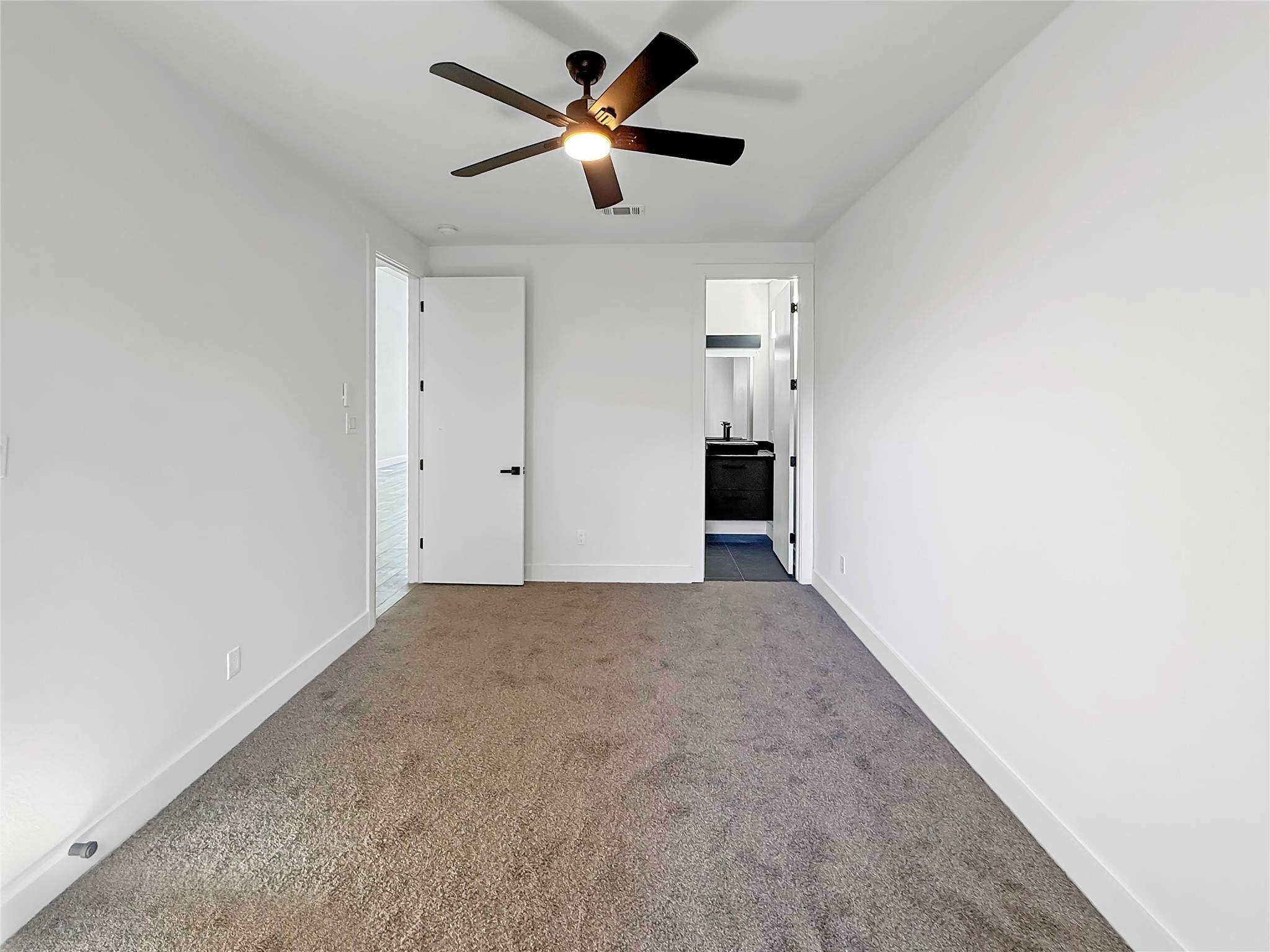 3115 Evella Street Houston, TX 77026 - Photo 15 of 21 an empty room with a ceiling fan and a window