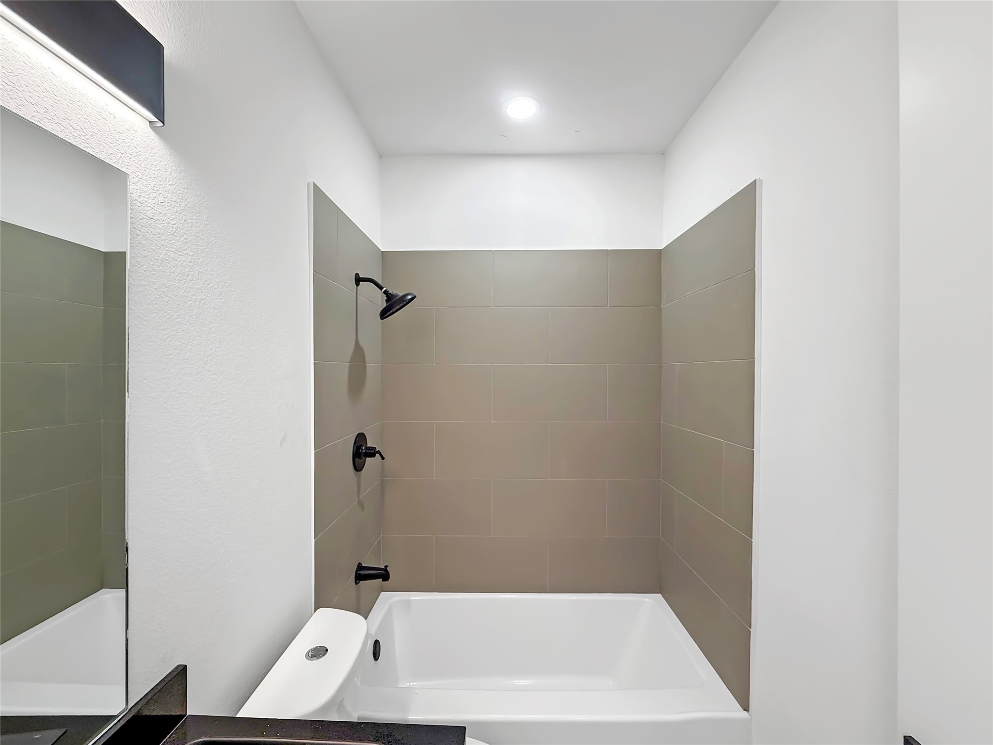 3115 Evella Street Houston, TX 77026 - Photo 19 of 21 a bathroom with a bathtub and shower