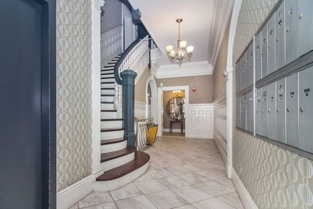 a view of a hallway view with staircase