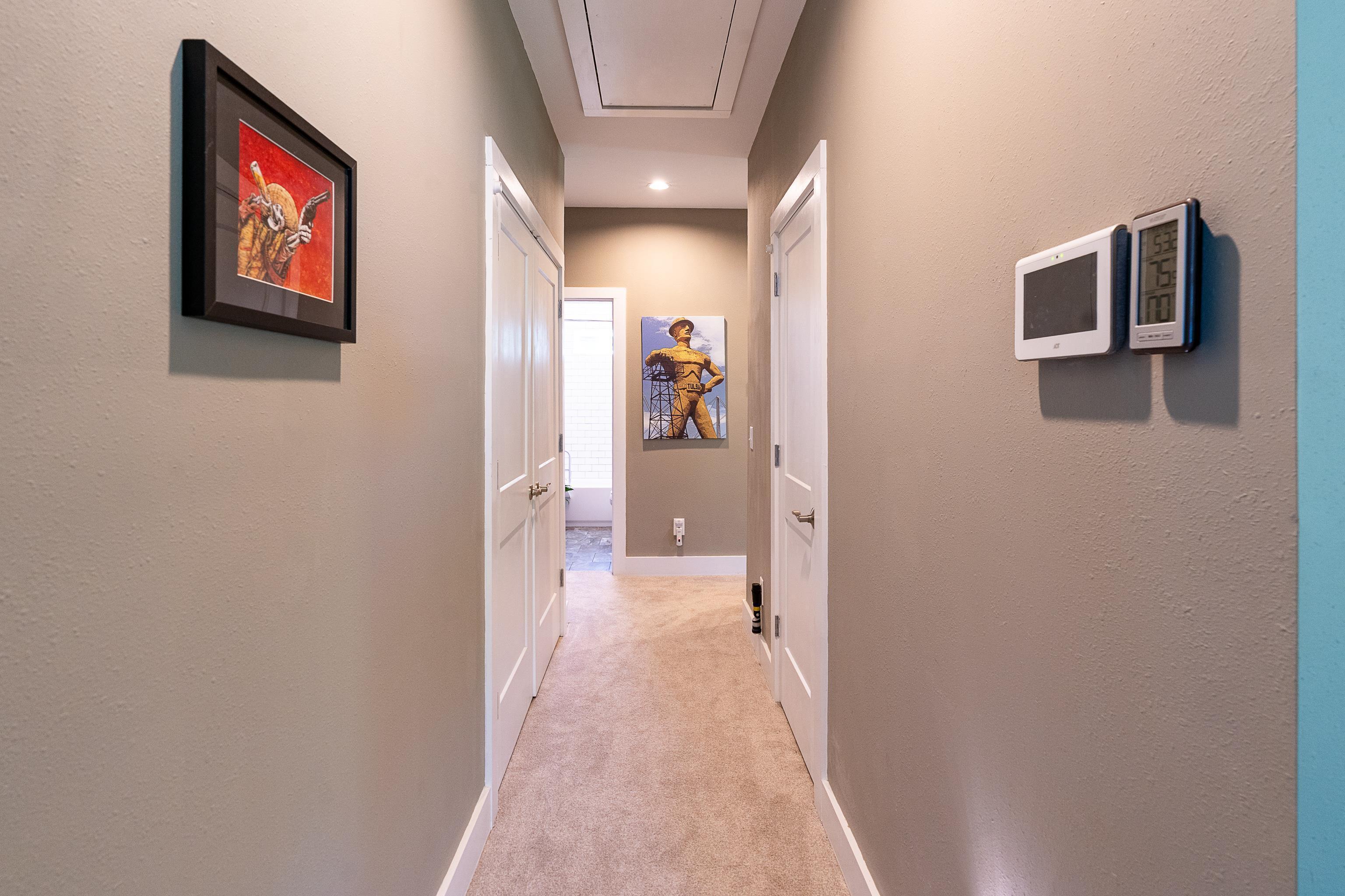 24616 Bretz Lane Elberta, AL 36530 - Photo 23 of 42 Central hallway to bedrooms featuring convenient utility closet.
