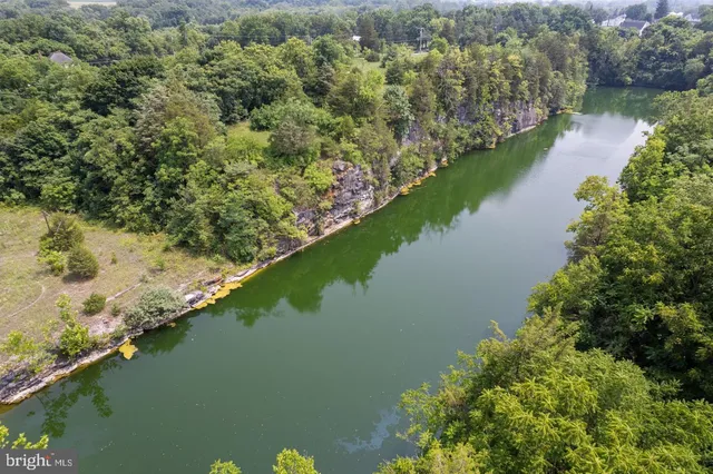 a view of a lake with a house in the background
