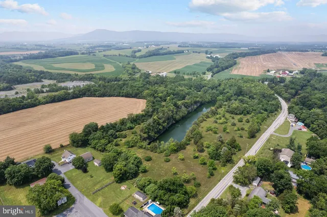 an aerial view of a residential houses and outdoor space