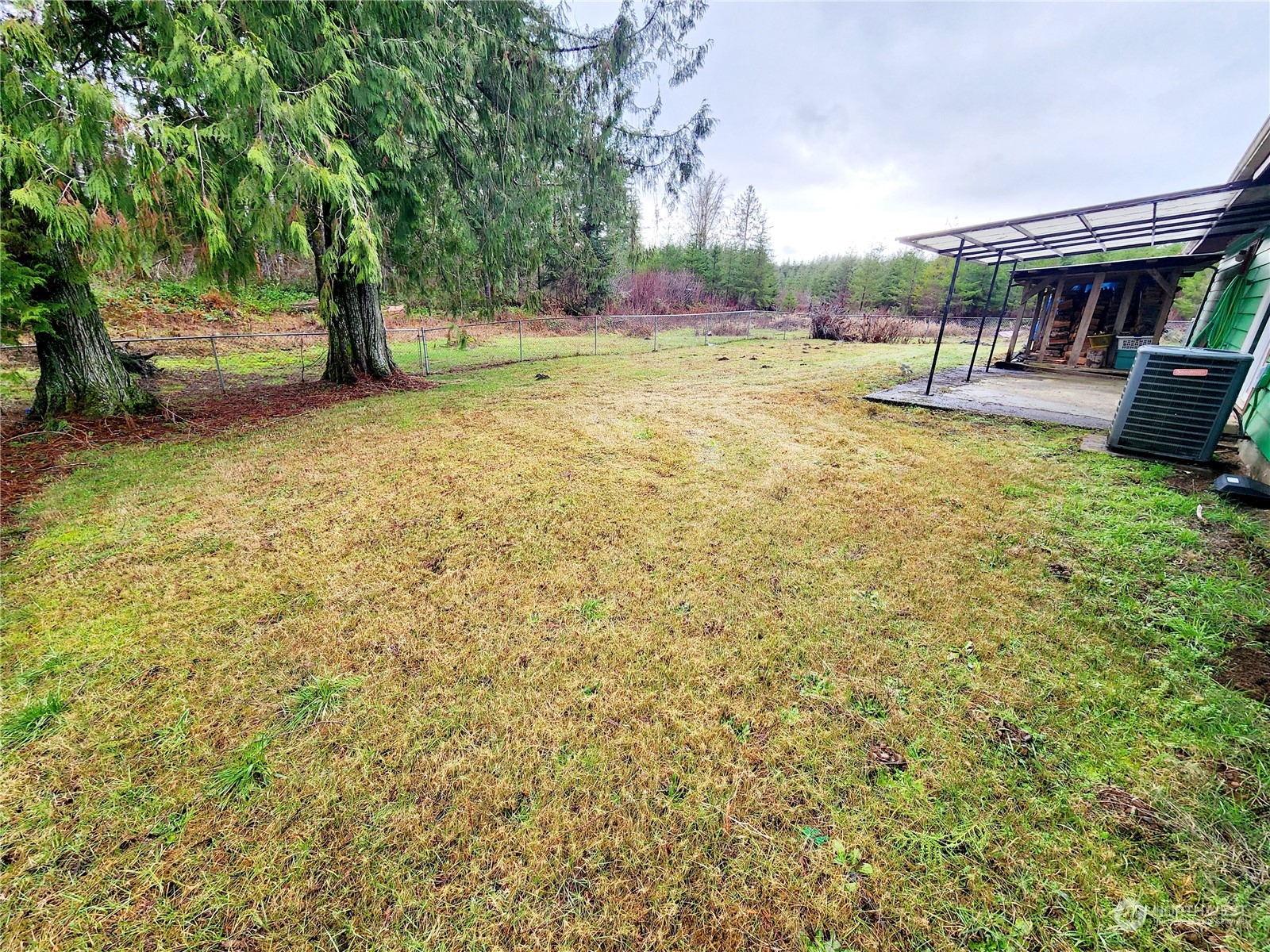 15 Foreman Road McCleary, WA 98557 - Photo 24 of 31 a view of swimming pool with outdoor seating and covered with trees