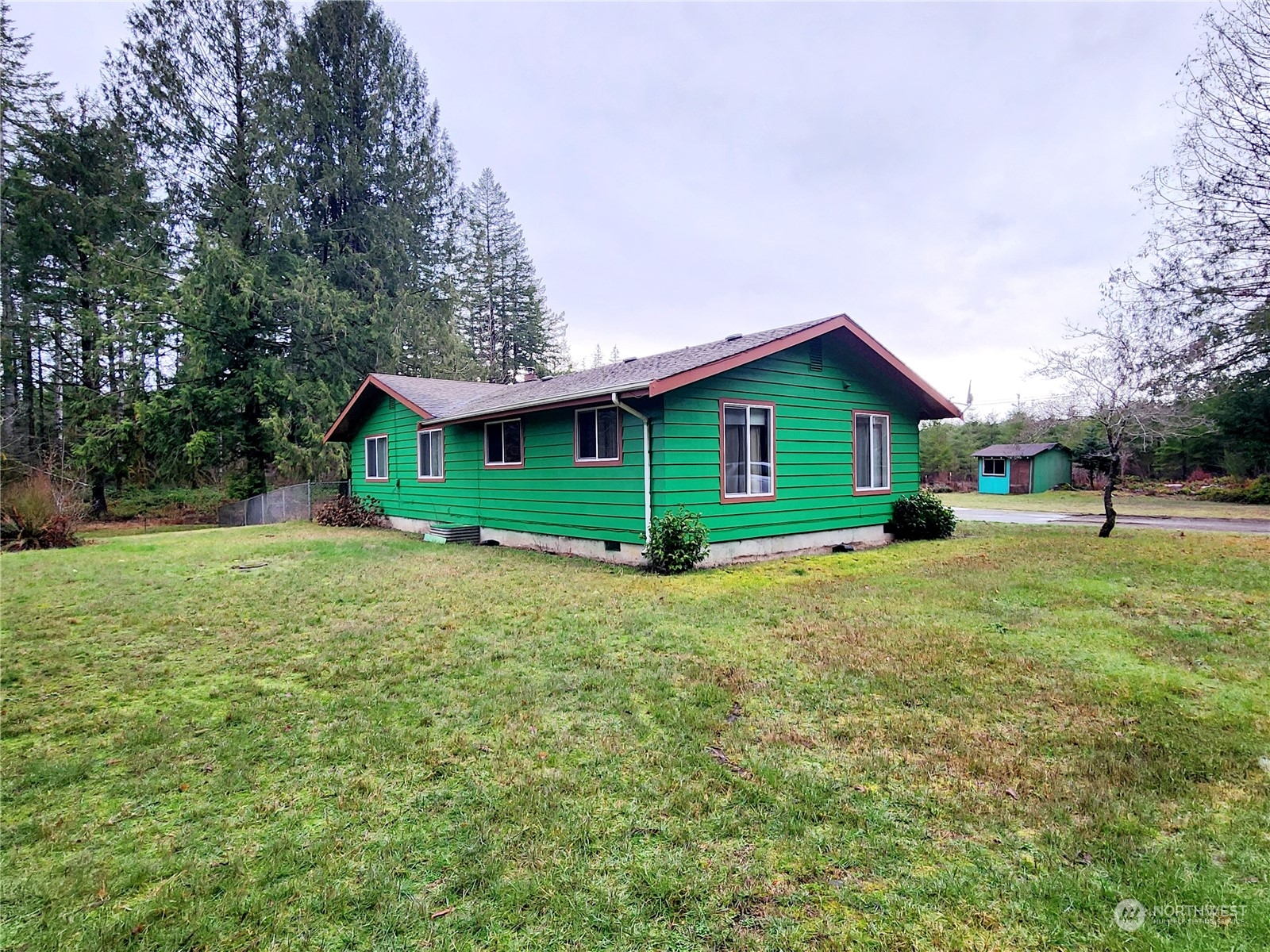 15 Foreman Road McCleary, WA 98557 - Photo 5 of 31 a front view of a house with a yard and garage