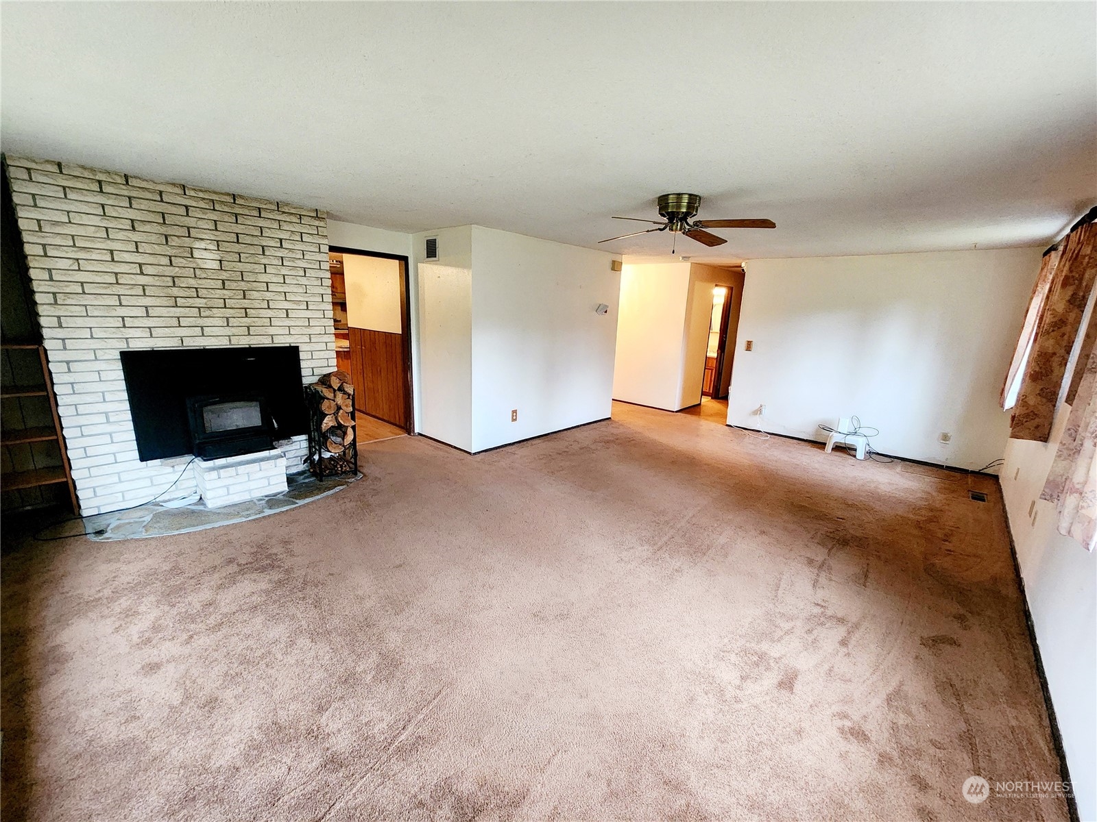 15 Foreman Road McCleary, WA 98557 - Photo 6 of 31 a view of a livingroom with a fireplace and window