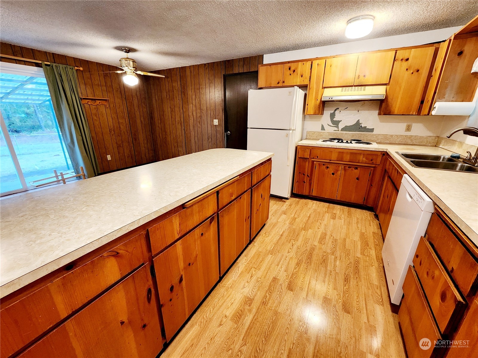 15 Foreman Road McCleary, WA 98557 - Photo 10 of 31 a kitchen with sink a refrigerator and a stove