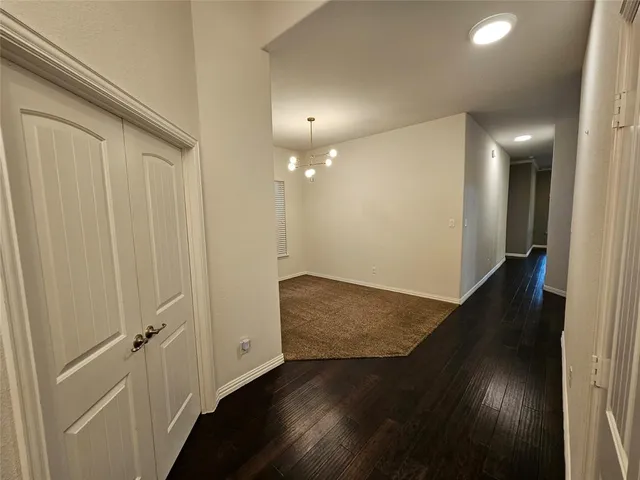 en empty room with wooden floor