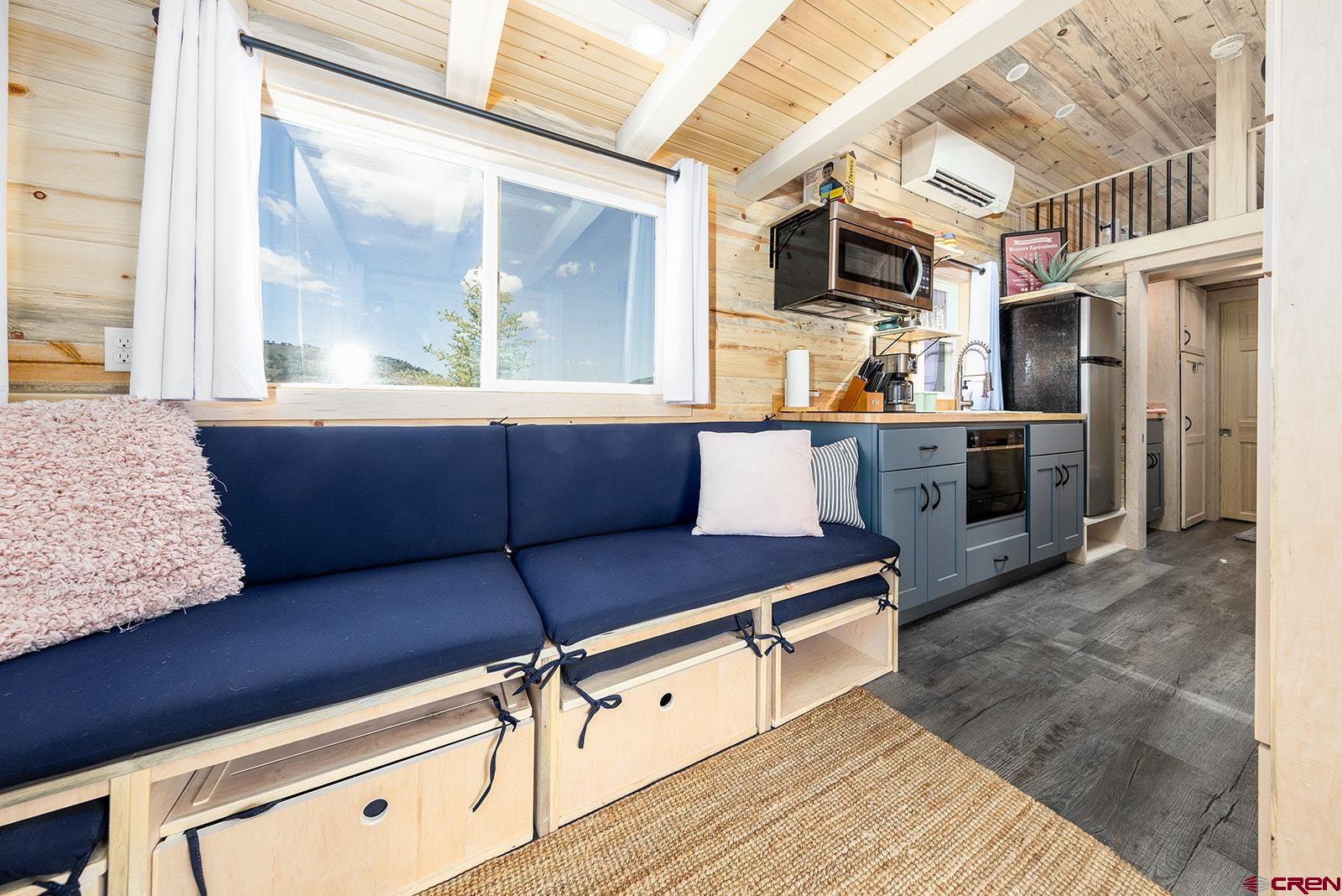 22130 6850 Road, Unit 210215 Montrose, CO 81403 - Photo 22 of 35 a kitchen with a sink appliances and cabinets