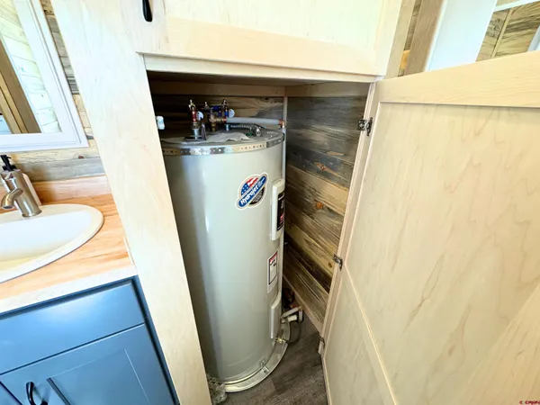a utility room with sink dryer and washer