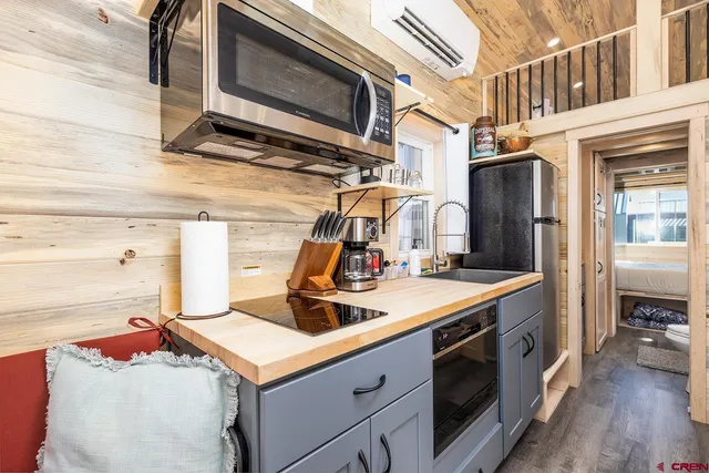 a kitchen with a stove and a microwave