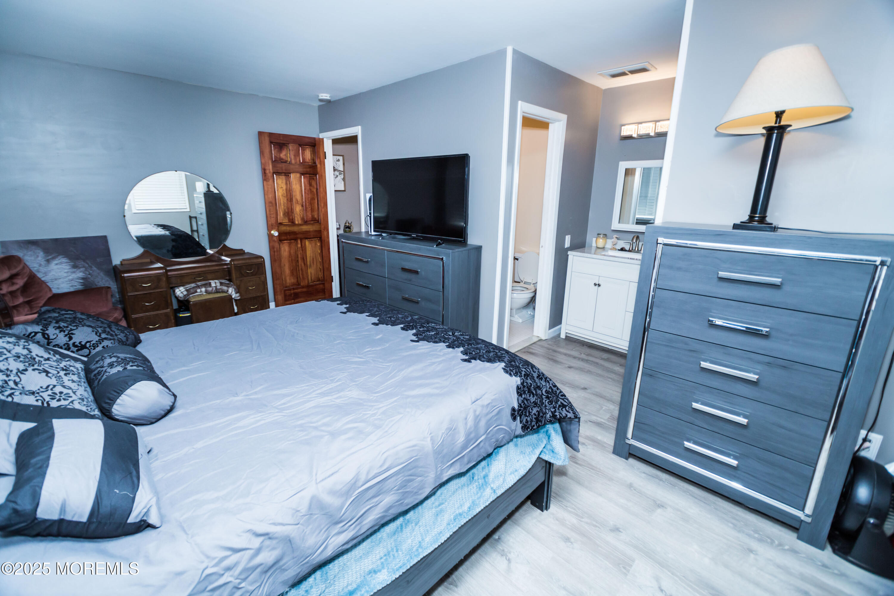 21 Birmingham Drive Jackson, NJ 08527 - Photo 15 of 27 a bedroom with a bed and wooden floor