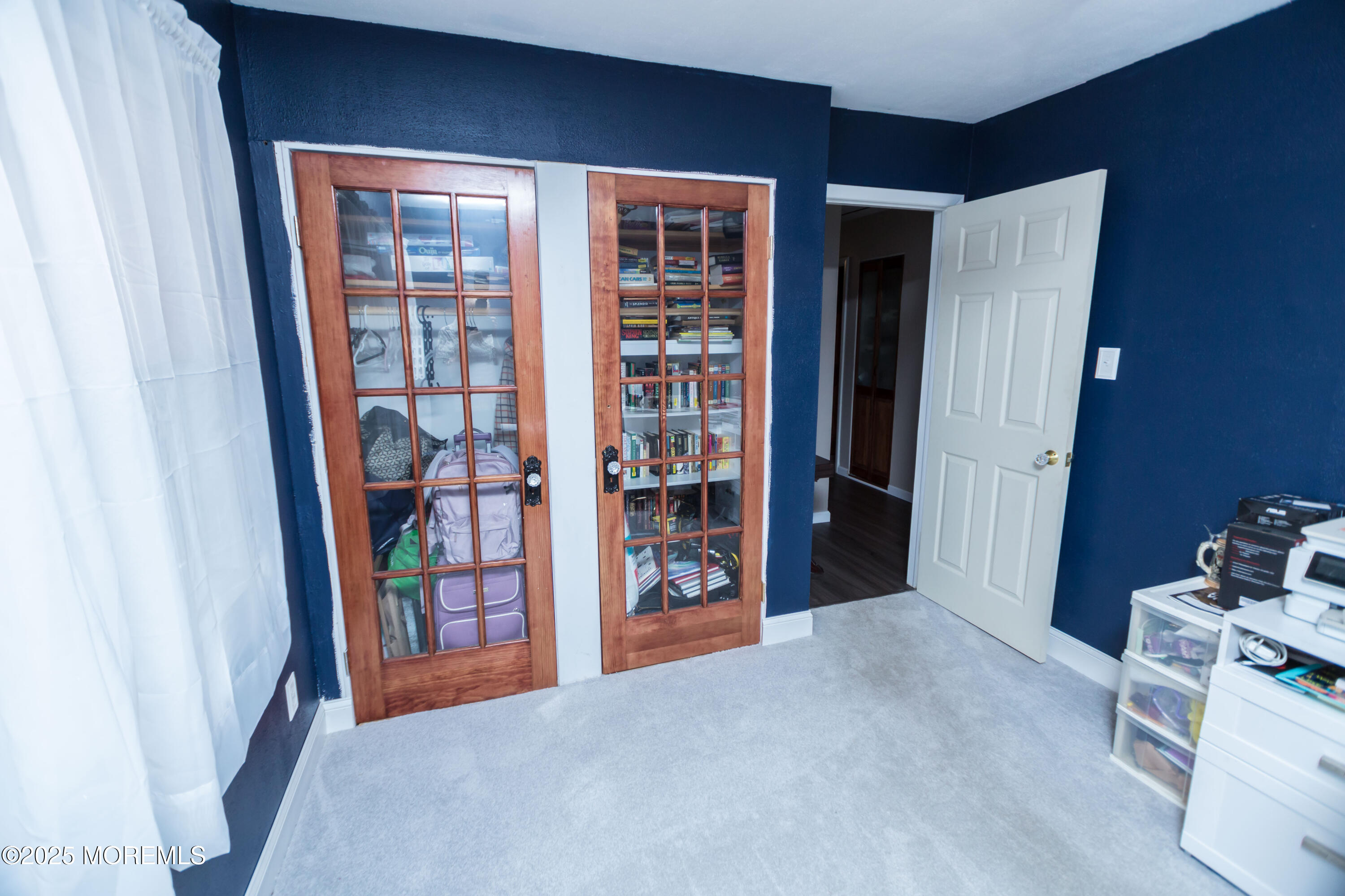 21 Birmingham Drive Jackson, NJ 08527 - Photo 23 of 27 a furnished livingroom with a bookshelf