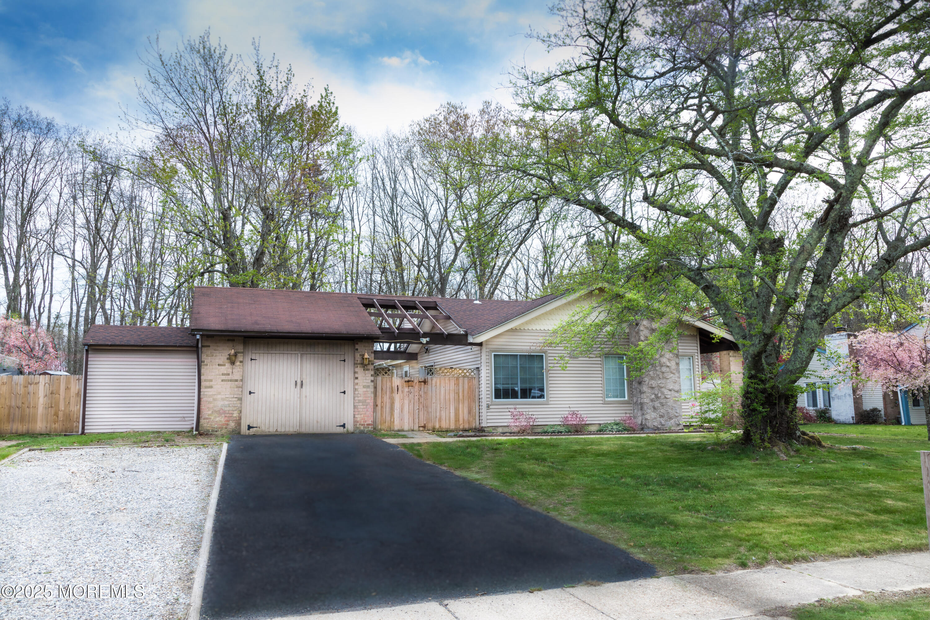 21 Birmingham Drive Jackson, NJ 08527 - Photo 3 of 27 a front view of a house with a garden