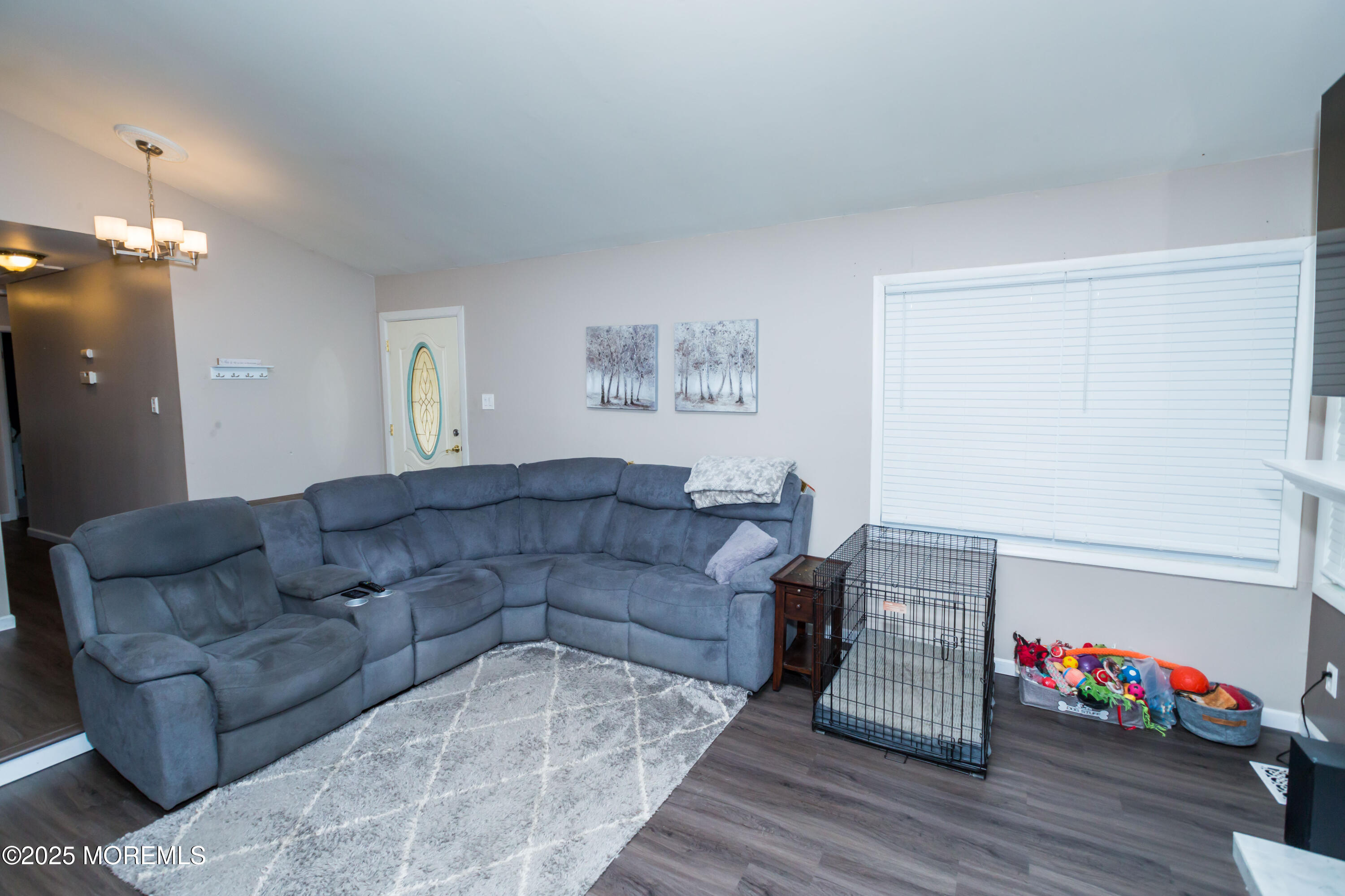 21 Birmingham Drive Jackson, NJ 08527 - Photo 4 of 27 a living room with furniture hard wood floor and a flat screen tv