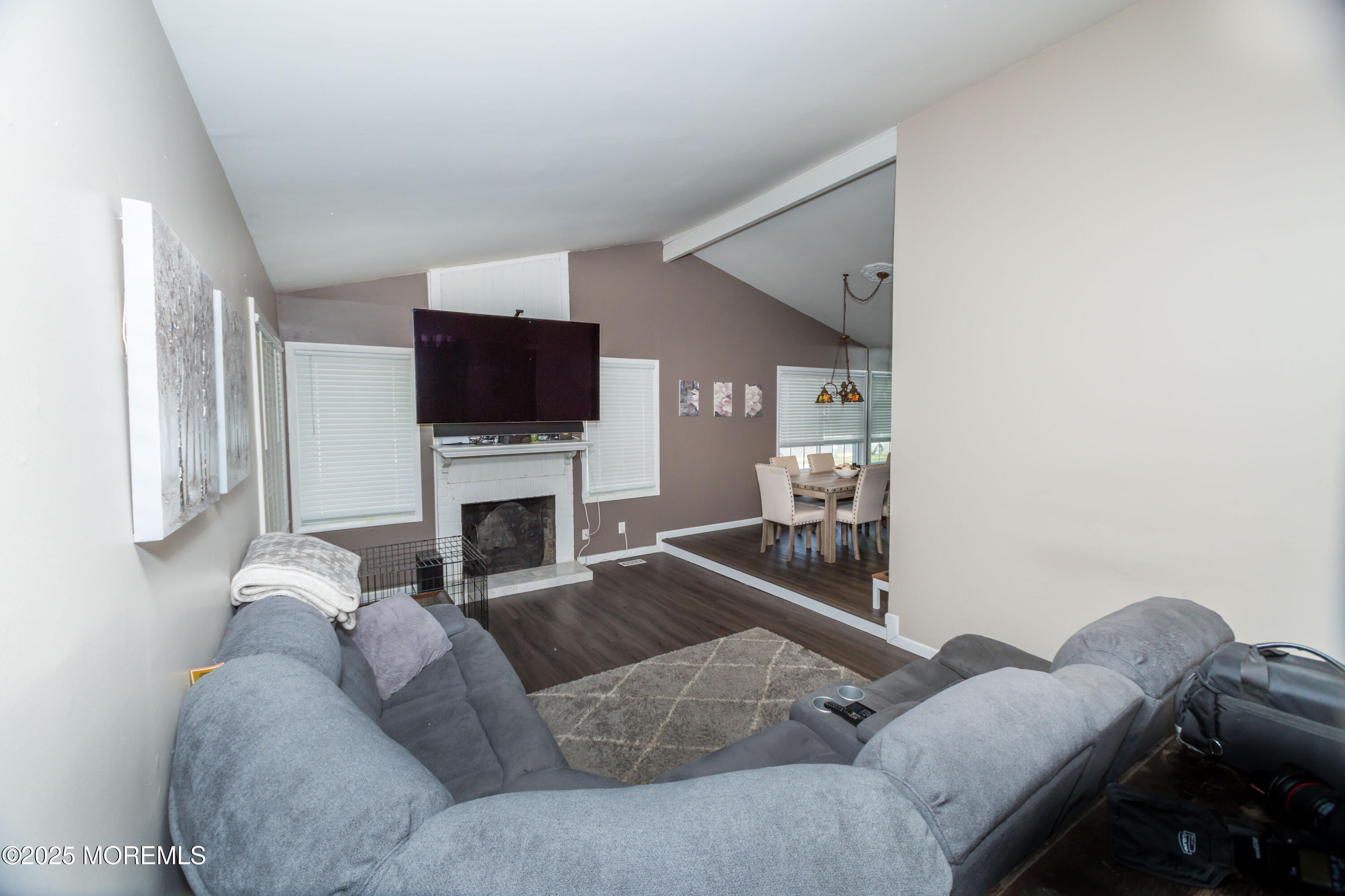 21 Birmingham Drive Jackson, NJ 08527 - Photo 6 of 27 a living room with furniture a fireplace and a flat screen tv