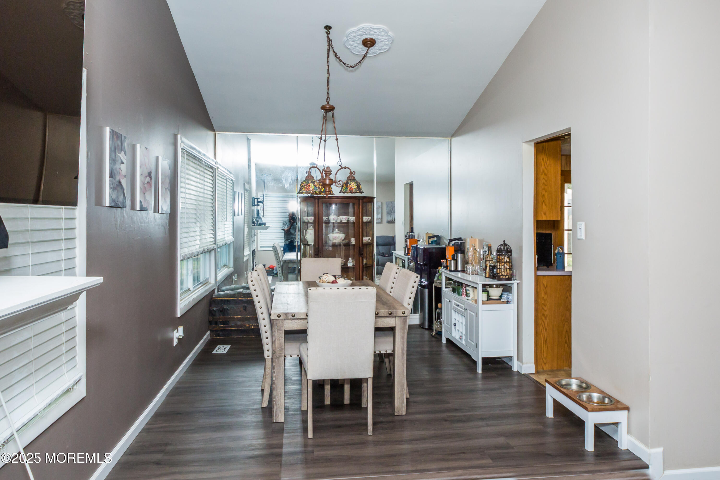 21 Birmingham Drive Jackson, NJ 08527 - Photo 8 of 27 a kitchen with stainless steel appliances a dining table chairs and chandelier