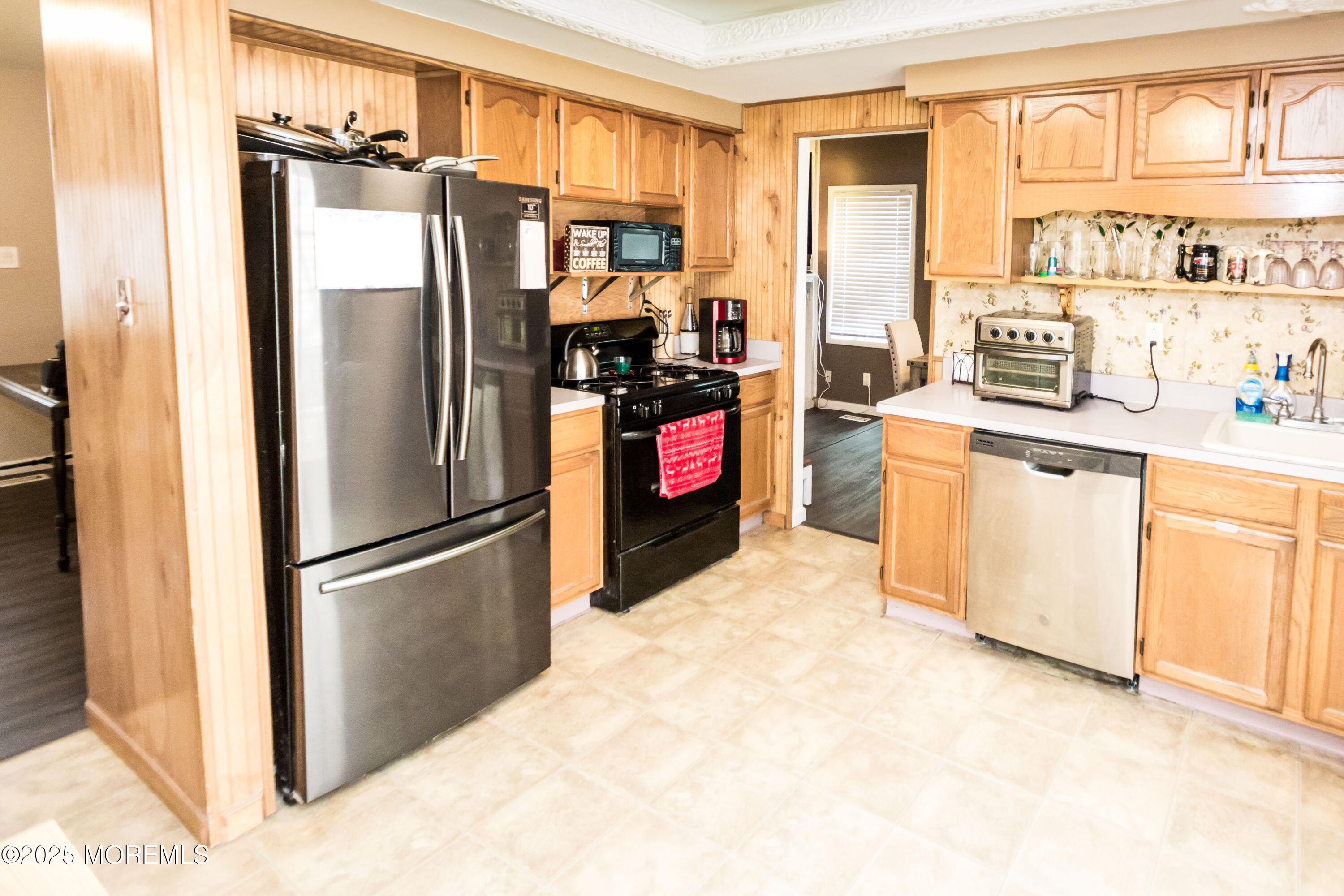 21 Birmingham Drive Jackson, NJ 08527 - Photo 9 of 27 a kitchen with stainless steel appliances a refrigerator and a stove