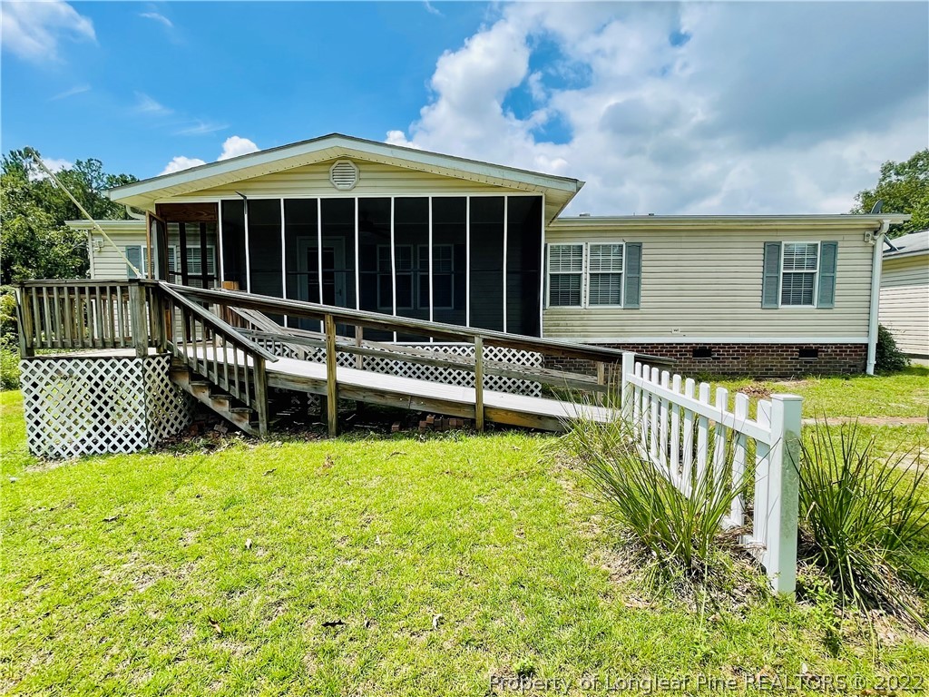 4684 East Raynham Road Fairmont, NC 28340 - Photo 1 of 26 a view of a house with backyard and porch