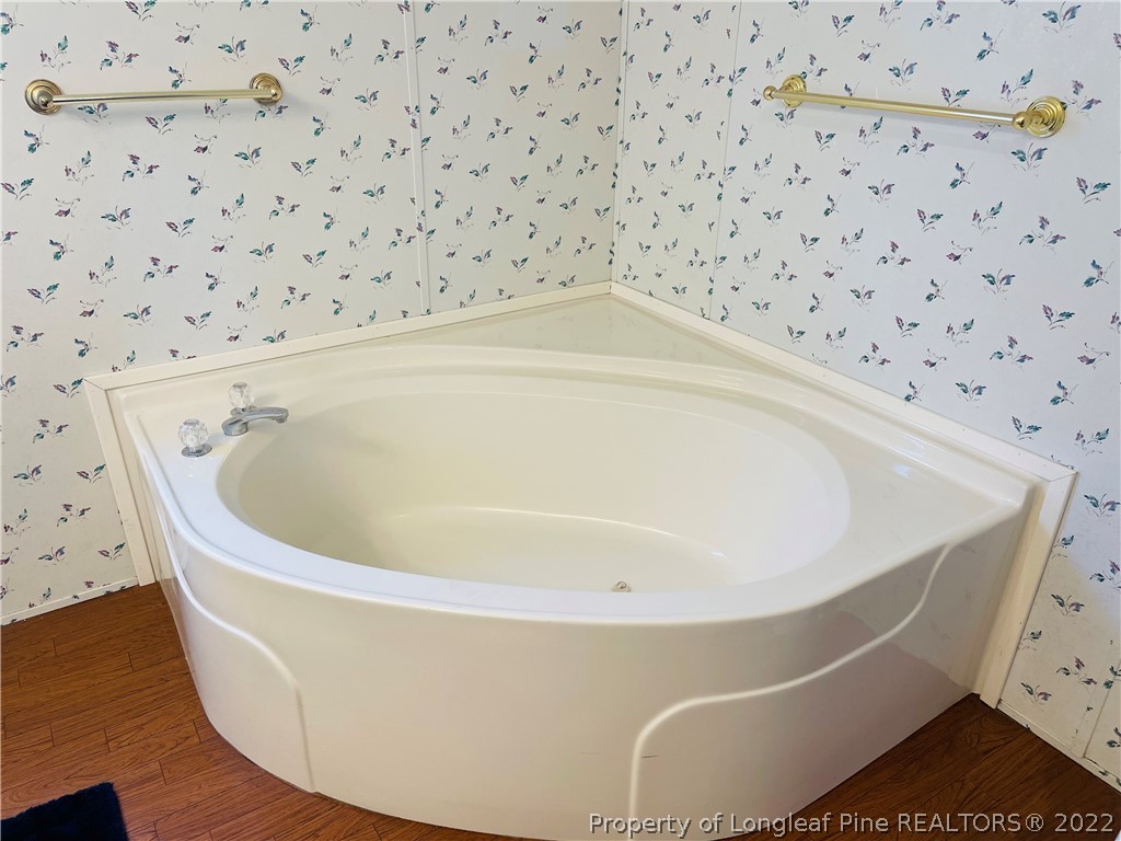 4684 East Raynham Road Fairmont, NC 28340 - Photo 14 of 26 a bath tub sitting in a bathroom