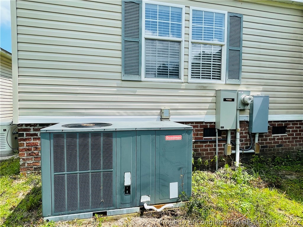 4684 East Raynham Road Fairmont, NC 28340 - Photo 22 of 26 a front view of a house with a garage