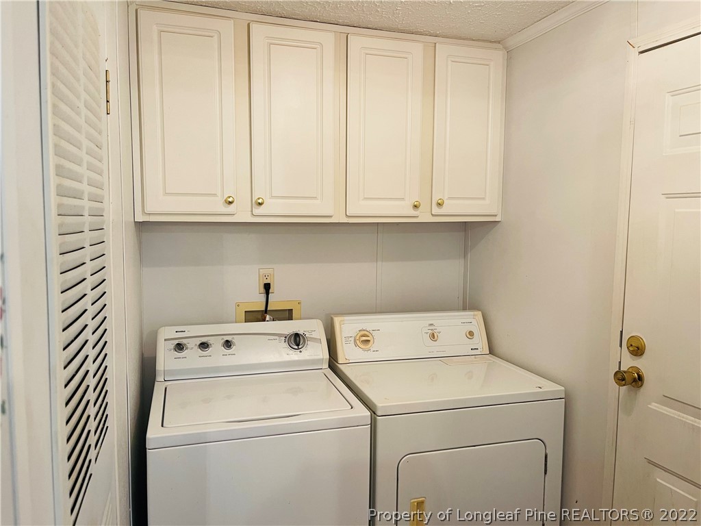 4684 East Raynham Road Fairmont, NC 28340 - Photo 8 of 26 a utility room with dryer and washer