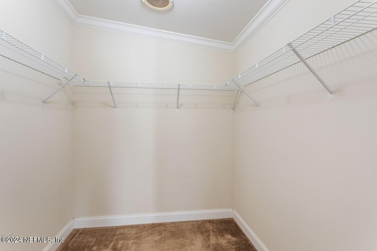175 Hawk Lane Hastings, FL 32145 - Photo 11 of 40 a view of a room with racks on the wall